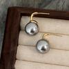 Pendientes de perlas elegantes, sencillos y de moda para mujer, nuevos pendientes de diseño de nicho de lujo ligero y elegante de alta calidad.