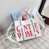 2024 Principios de Primavera Gran Capacidad Lona Letras Mujeres Ligero Casual Simple Bolso de Mano Hombro Cruzado Bolso Tote Nuevo