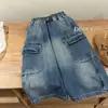 Calça Jeans Longa Infantil 2026 Nova Coleção Primavera e Outono Meninos e Meninas Calça Cargo com Bolso Grande Calça Casual Soltinha para Bebê Tendência