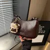 Bolso cruzado retro casual simple para debajo del brazo, nuevo bolso de mano para commuting otoño 2026, bolso versátil de hombro y cruzado