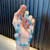 Lindo Colgante Llavero de Cristal con Cuentas de Flor Cadena Pequeña para Teléfono Cadena de Bolso Wholesale de Pequeños Productos de Yiwu