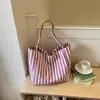 Bolso de lona a rayas de moda para mujer 2026 nuevo modelo bolso tote de gran capacidad bolso de hombro casual de gran capacidad para el trabajo