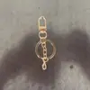 Llavero de hebilla de puerta giratoria, cadena de cuatro secciones, hebilla de ocho, colgante de cuenta, decoración de bolso, llavero, accesorios para llavero