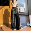 Foto real de elegantes pantalones anchos de capas con accesorios en la cintura para mujer, nuevo lanzamiento de verano 2026, de cintura alta, fluidos, de seda helada, algodón y lino, casuales