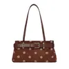 La popular bolsa cuadrada pequeña fresca de mano para mujer de este año, nuevo estilo otoño 2026, bolso de hombro único con textura de lunares, bolso para el hombro para el trabajo