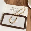 Collar Maillard en capas para mujer, cadena vintage para clavícula con piedra de ojo de tigre, color castaño, cadena para suéter de lujo ligero de nicho para otoño e invierno