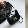 Estilo francês nicho moda feminina bolsa 2024 nova axila saco doce cor sólida laço portátil bolsa feminina saco crossbody