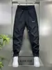 Calça Harem Preta Elegante Versátil com Cordão na Cintura 2026 Nova Masculina Secagem Rápida Casual Esportiva Simples e Respirável