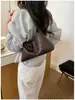 Bolso de hombro tejido de diseño de nicho de alta gama transfronterizo para mujer, nuevo bolso de mano 2026, elegante bolso de hombro para mujer