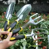 Juego de herramientas de jardinería para jardín al por mayor pala de jardín pala aleación de magnesio y aluminio mango de silicona de dos colores juego de cuatro piezas