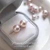Pendientes de botón redondos de plata pura s999 con perla Swarovski, pendientes sencillos y versátiles de alta gama, nuevos y populares clips para orejas y accesorios 2026