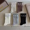 Calcetines de otoño e invierno para mujer, de longitud media hasta la pantorrilla, con un patrón Fair Isle, un estilo coreano sencillo y un diseño trenzado, hechos de algodón puro