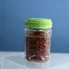 El Fabricante Suministra Botellas Cuadradas de 850 ml con Tapas Portátiles, Botellas para Alimentos con Boca de 88 mm y Botellas de Plástico para el Empaquetado Sellado de Frutos Secos