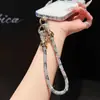 Moderna correa de alta gama para teléfono móvil con pulsera de diamantes completos y cuentas doradas, correa anti-pérdida para uso en exteriores, adecuada para teléfonos móviles, bolsos y llaveros