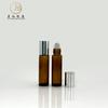 En stock Empaque de botella de cuentas marrones 10 ml material de empaque de botella de bola protección ocular masaje aceite esencial productos de vidrio botella vacía venta al por mayor