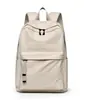 Mochila simples de cor sólida e grande capacidade, leve e versátil, adequada para viagens curtas, bolsa de viagem impermeável, mochila escolar para alunos do ensino fundamental II e médio