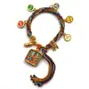 Pulseira do deus da riqueza de cinco vias estilo Xizang oito santos padroeiros cinco mestres Manjushri deus da riqueza amarelo thangka corda tecida à mão pulseira do ano desta vida