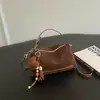 Bolsa de mão retrô transfronteiriça tipo bolsa-almofada para mulheres, nova bolsa de ombro para o dia a dia estilo coreano de nicho, bolsa transversal simples