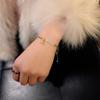 Versión coreana de pulsera tejida de cuerda trenzada de jade Hetian con flor de loto ins regalo de este año de vida cuerda de mano pulsera de pareja al por mayor