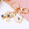 Llavero Creativo de Metal con Trébol de Cuatro Hojas para Coche Colgante para Bolso de Mujer Anillo Llavero Exportación de Aliexpress Pequeños Regalos al por Mayor