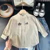 Colección Primavera 2026 Moda Infantil Camisa de Algodón de Manga Larga Estilo Coreano de Moda con Cuello Pequeño Venta al por Mayor