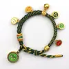 Pulsera tejida a mano estilo Tíbet con Cinco Deidades de la Riqueza, Pulsera Thangka, Colgante Ojo del Dharma del Dios de la Riqueza, Pulsera de Hilo Rojo con Cascabel