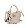 Bolsa de cubo texturizada de alta calidad al por mayor para mujer, nuevo estilo verano 2026, color liso, elegante bolsa de hombro, bolso cruzado para madre e hija