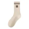 Colección de otoño de calcetines de media pantorrilla para mujer, modernos y elegantes, perfectos para combinar con pantalones de otoño, suaves y cálidos, un calcetín de nicho y de moda