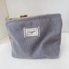 Bolsa de cosméticos de lona de pana pequeña fresca de gran capacidad portátil color sólido almacenamiento simple clutch cosmético al por mayor