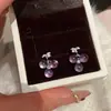 Pendientes de botón de uva amatista para mujer 2026 Nuevo estilo popular de alta gama de nicho diseño único pendientes de lujo ligero de temperamento accesorios
