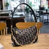 Pago de pedido Nueva Fuente Fábrica Bolso Mujer Moda Retro Lona Diseño de Nicho Cadena de Hombro Única Bolso de Mano para Debajo del Brazo
