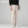 Nuevos pantalones de traje de invierno para hombre, estilo de negocios para commuting, con forro polar, engrosados y con efecto de caída, simples, transpirables, que realzan la altura y de lujo ligero