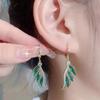 Aretes de alas de cristal verde voladoras dobles de verano Biyi diseño de nicho femenino avanzado 2024 Nuevos aretes únicos de estilo occidental