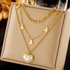 Diseño de nicho de moda europea y americana acero de titanio cadena mixta multicapa apilada perla colgante de amor joyería collar para combinar con todo