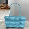 Estilo Ins Coreano Cesta de Vegetais Trançada Vazada Bolsa de Praia Casual de Férias Cor Doce Bolsa a Tiracolo de Ombro Bolsa de Rattan