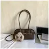 Bolsa Feminina Nicho Estilosa Retro de Alto Acabamento 2026 Nova Moda Inverno Casual Versátil Ombro Transversal Tendência