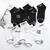 Calcetines Zhuji al por mayor Primavera y Otoño Todas las estaciones Hombres y Mujeres Mismo estilo Pareja Nuevos Calcetines Deportivos Casuales para Correr Calcetines para Hombre