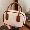 Bolsa de Mão Nicho Transfronteiriça para Axila Feminina 2025 Nova Cor Retro Color-Blocking Bolsa Transversal Versátil Bolsa Bowling Tendência
