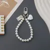 Colgante de Figura Cuadrada Amor Vintage Lanyard para Teléfono Móvil Cadena de Mano Perla Estilo Pequeño Fragante Estilo INS para Mujer Antiperdida