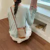 Bolsa para Celular Feminina 2026 Verão Novo Estilo Bolsa de Balde Trançada Mini Bolsa Pequena para Caminhar com Toque de Luxo Bolsa de Ombro Único Transversal