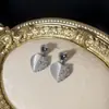 Venta caliente aguja de plata S925 Corea del Sur sentido de diseño de moda exquisito red piedra ojo de gato famosa doble hechizo amor pendientes pendientes pendientes