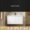 Tocador de baño engrosado y ahorrador de espacio con diseño en color crema, que cuenta con un lavabo redondeado, lavabo cerámico integrado y un lavabo de una sola pieza.