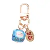 Estilo Chino Atrae Fortuna Cerámica Gato de la Suerte Llavero Colgante Estuche para Auriculares Bolso Encanto Accesorio Adornos Pequeños Venta al por Mayor