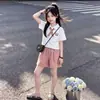 Top de manga corta con cuello polo de personalidad simple para niña, nuevo de verano, casual, holgado, versátil, conjunto de dos piezas para niña