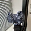 Bolso de mano versátil de mezclilla para mujer, nuevo estilo 2026, bolso de moda para chica, bolso de hombro plisado para el trabajo