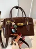 Bolsa de ombro feminina de nicho super popular transfronteiriça, nova moda de verão 2026, bolsa transversal moderna de alta qualidade, bolsa almofada requintada