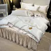 2026 Novo Conjunto de Saia de Cama Lavada de Seda Gelada de Quatro Peças com Acabamento de Renda, Lençol Bordado, Conjunto de Três Peças de Tencel