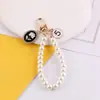 Estilo Nuevo de Primavera Chanel Perla Cadena de Mano DIY Hecho a Mano Bolso Casero Funda para Teléfono Móvil Llavero Accesorios