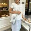 Versão coreana 2026 nova bolsa pequena de nicho para mulheres, bolsa de balde trançada artesanal moderna e de alta qualidade, bolsa transversal versátil