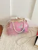 Bolso de mano para mujer al por mayor transfronterizo con flores bordadas y perlas, bolso de mano con forma de concha, modelo 2026, bolso de hombro con cadena y flecos, bolso cruzado